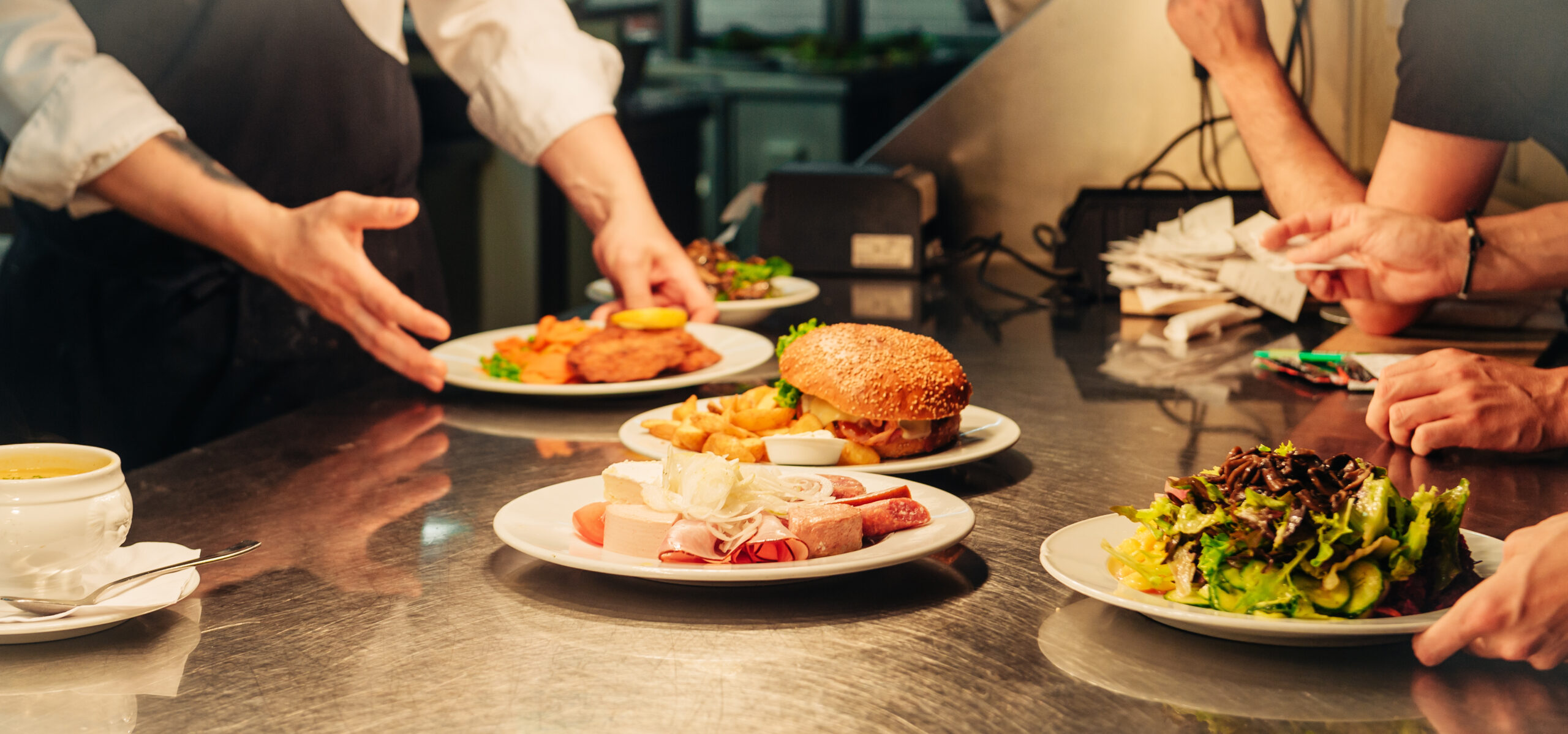 Food orders on the kitchen table in the restaurant